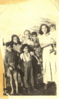 Carmel “Carmen” Sanchez-Young holding toddler, far right Carmel “Carmen” Sanchez-Young holding toddler, far right